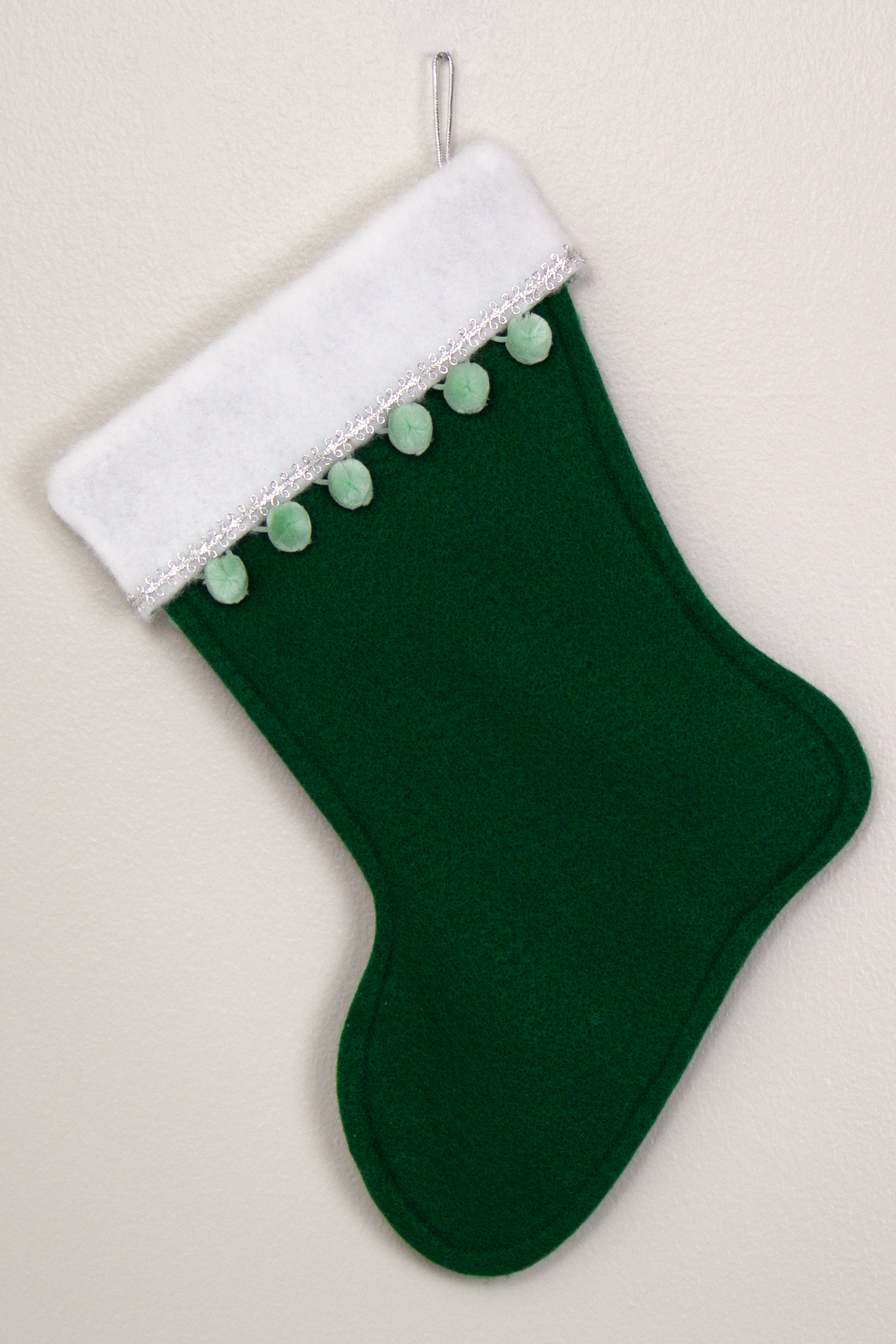 Christmas stocking on dark green felt. (back of Akita stocking)