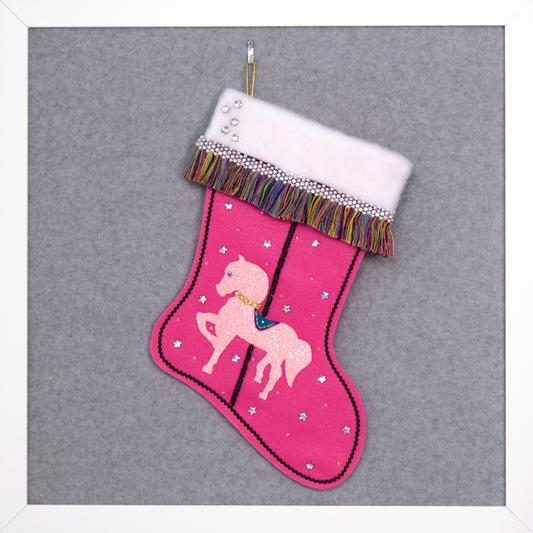 Light pink glittered horse on candy pink felt handmade Christmas stocking with multicolor fringe, star rhinestones, tinsel pipe cleaner pole and decorations in white, clear, holographic, turquoise, purple, black & gold. (front of Carousel Horse stocking)
