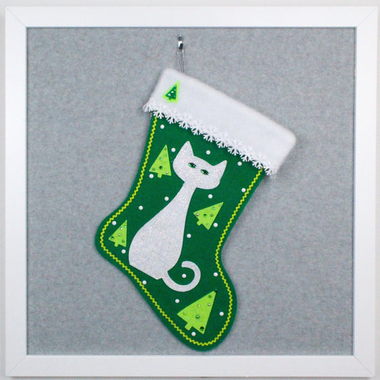 Glittery white cat on holiday green felt handmade OOAK Christmas stocking with tree and snowflake decorations in white and lime green.