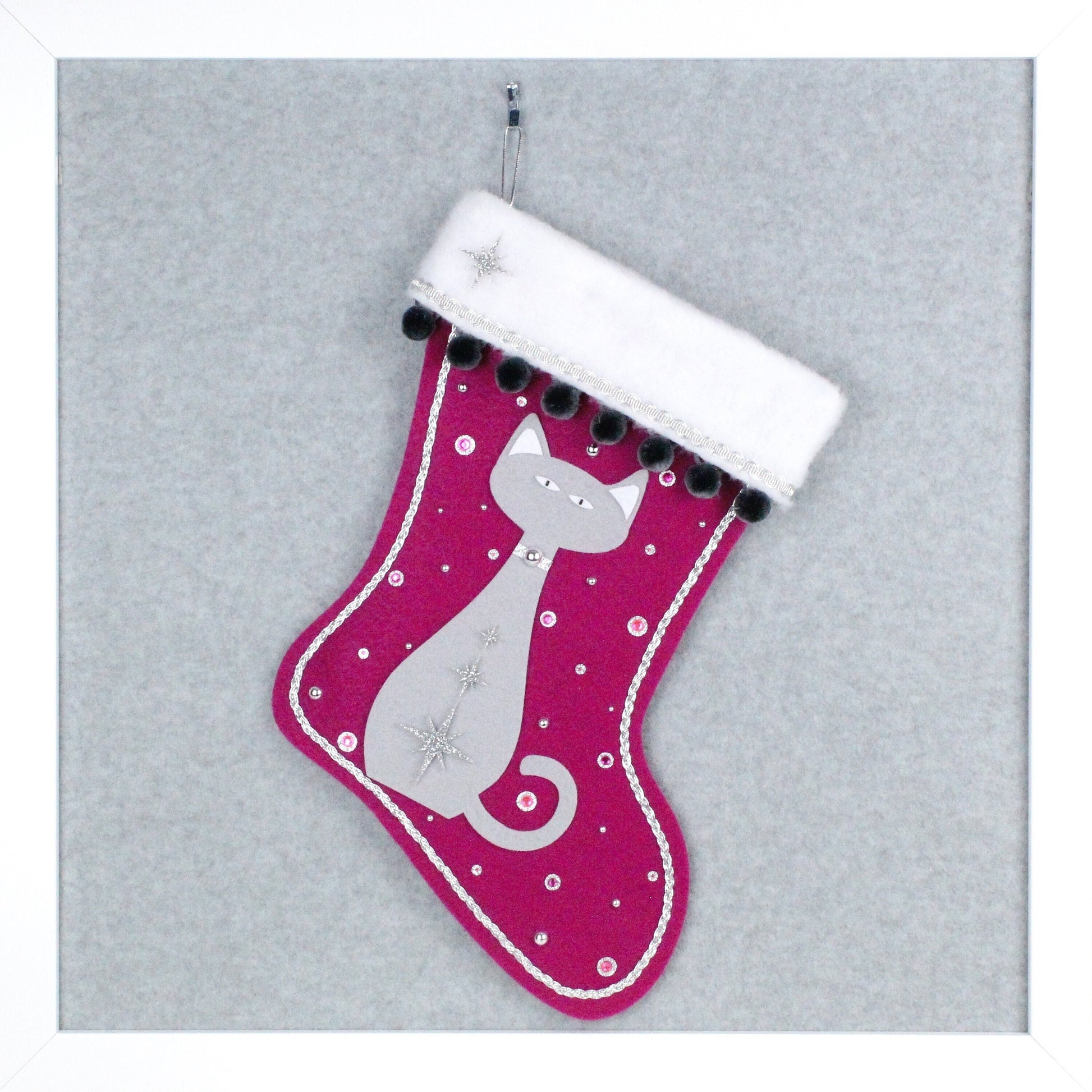 Light gray cat on fuchsia felt handmade OOAK Christmas stocking with dark gray pom poms and silver decorations.