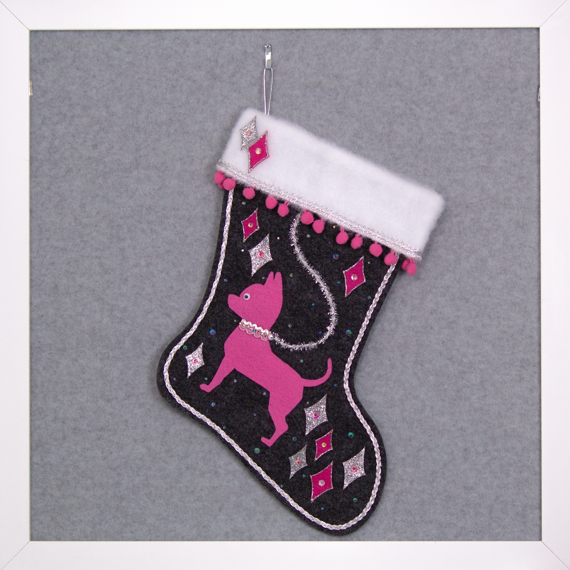 Candy pink short hair Chihuahua dog on charcoal gray felt handmade Christmas stocking with felt diamonds, pom poms and decorations in hot pink, candy pink, clear holographic and silver. (front of stocking)