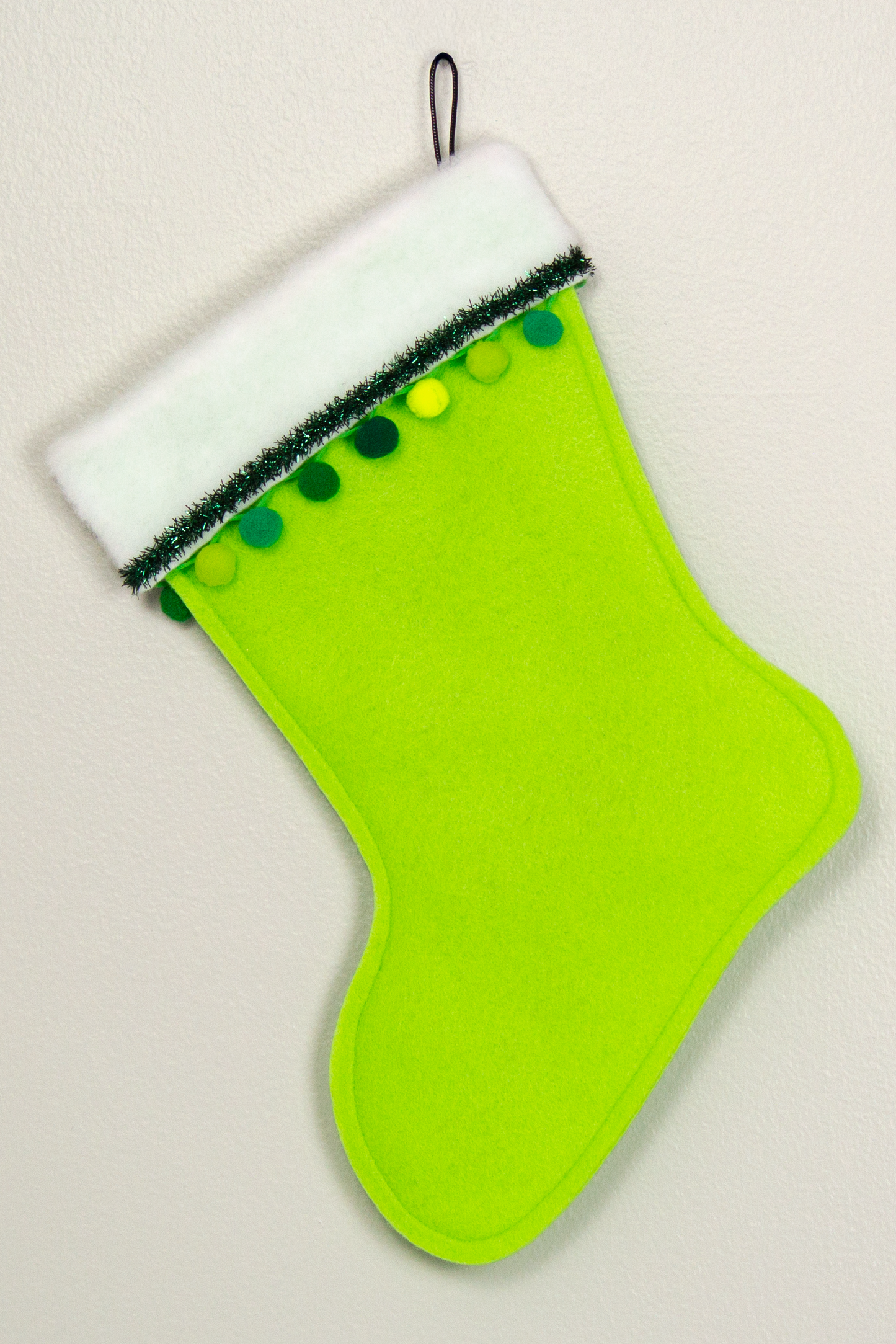Black Chihuahua dog on green felt Christmas stocking