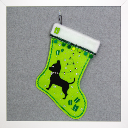 Black short hair chihuahua dog on neon green felt handmade one of a kind Christmas stocking with decorations in green and silver.