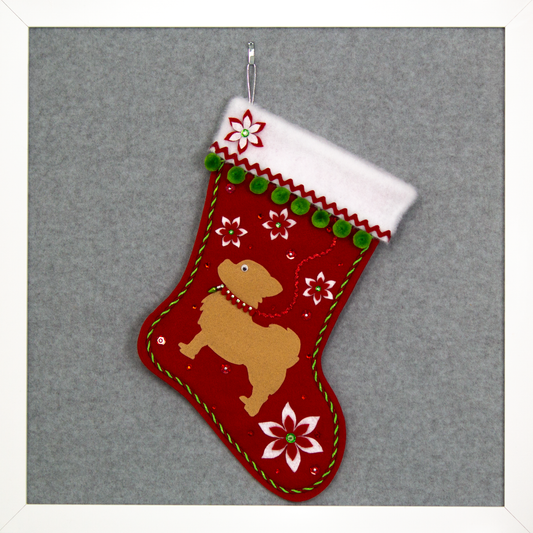Red glitter Christmas stocking with tan long hair Chihuahua small dog silhouette with pom poms, felt poinsettias and decorations in green, red and silver. (front of stocking)