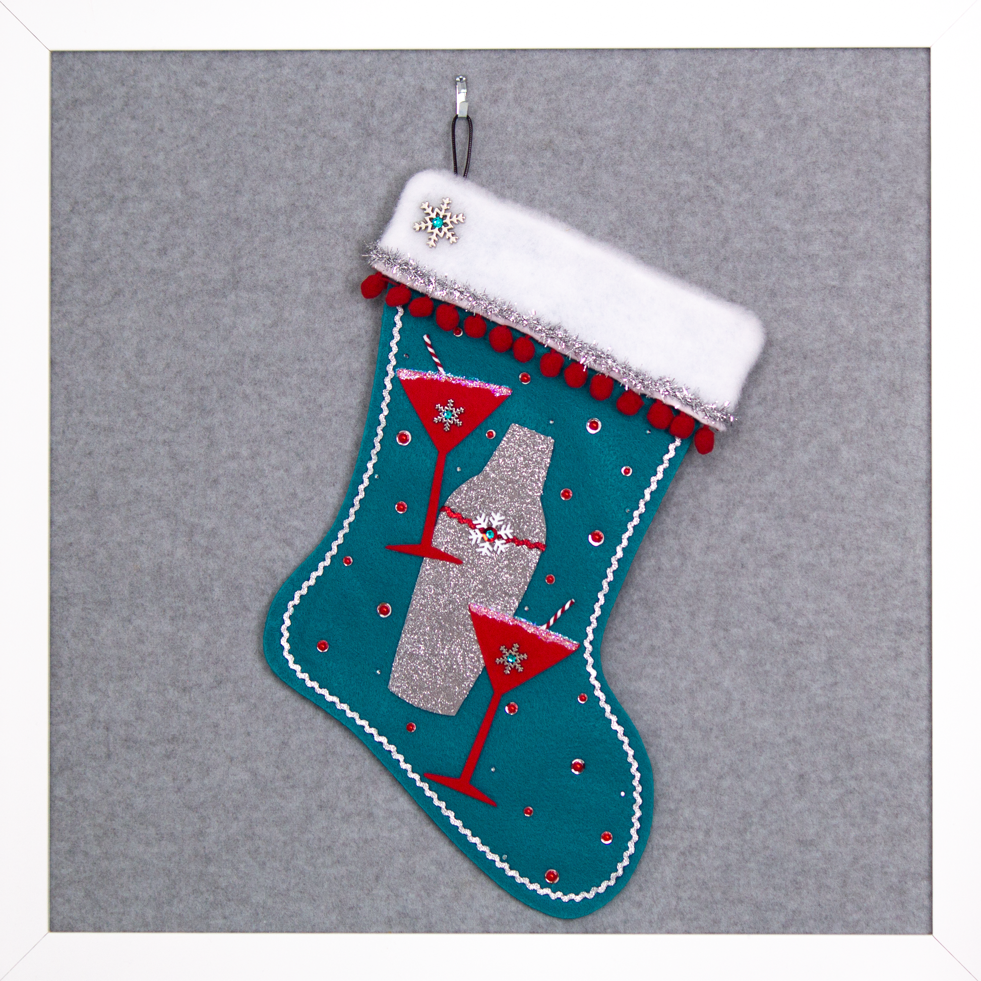 Holiday red felt martini glasses, silver glitter painted gray felt shaker on turquoise felt handmade Christmas stocking with snowflake buttons, pom poms, tinsel ribbon and decorated in  red, turquoise, white & silver. (front of Cocktail stocking)