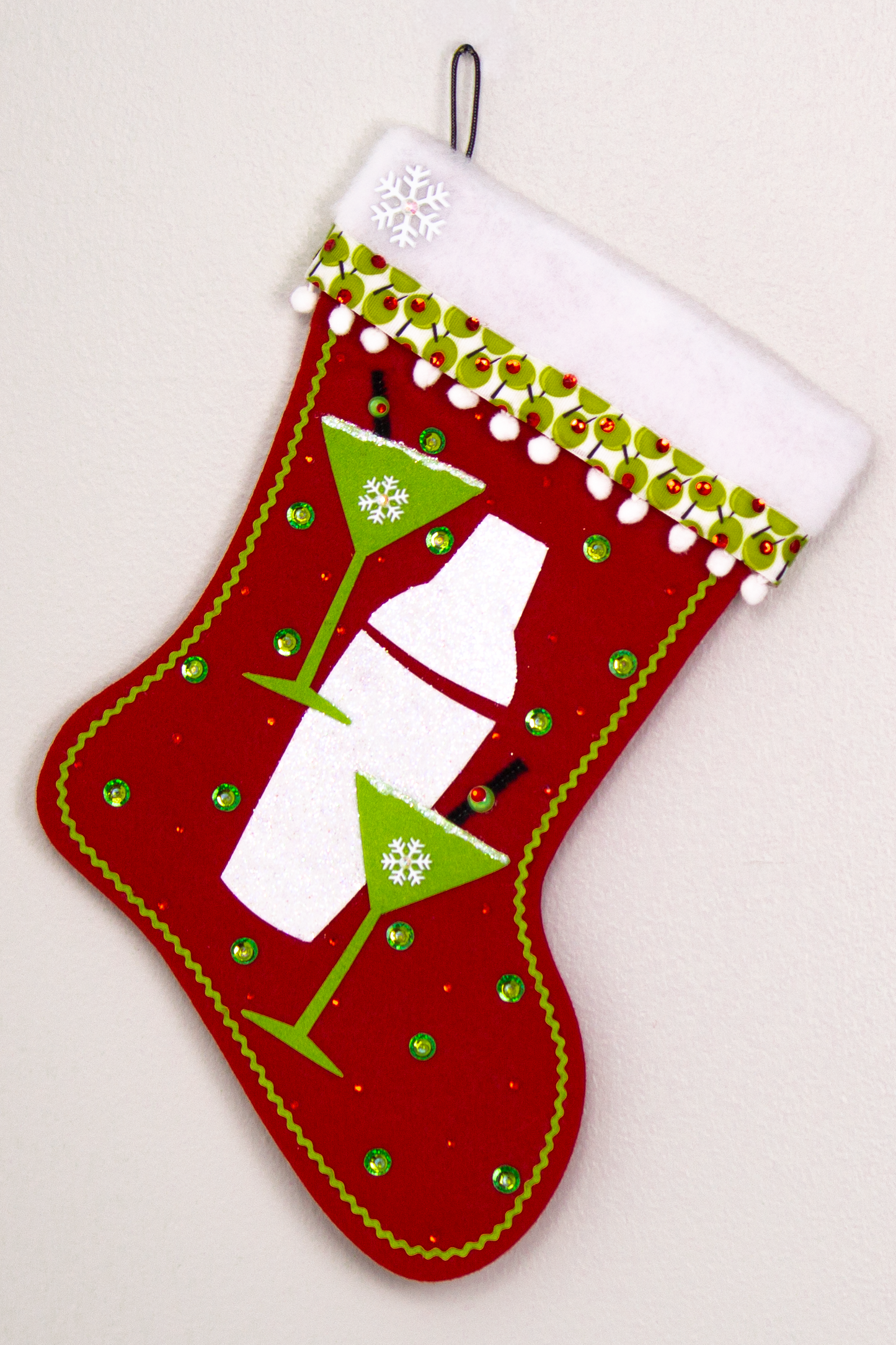 Glitter painted lime green felt martini glasses, chunky glitter painted white felt shaker on a holiday red felt handmade Christmas stocking with snowflake buttons, pom poms, olive ribbon and decorated in green, red, white, black & silver. (front of Cocktail stocking)