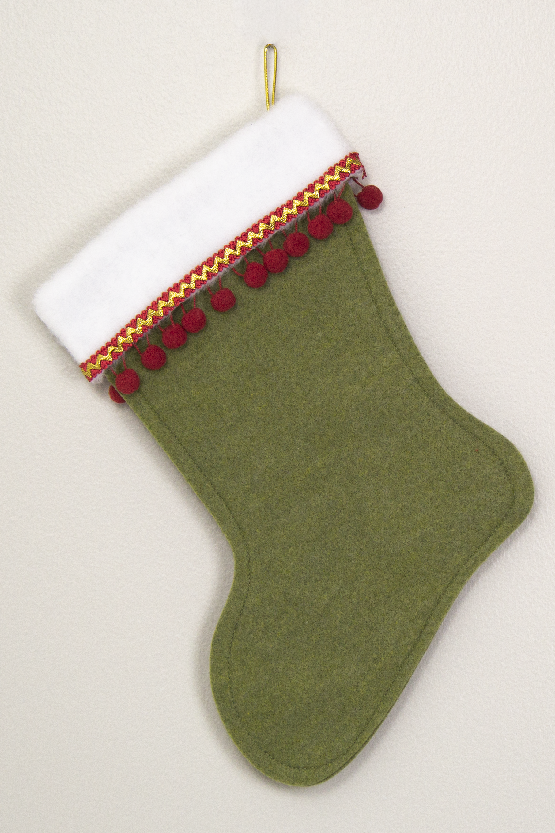 Olive green felt Christmas stocking,  decorated in gold and red. (back of Corgi dog stocking)
