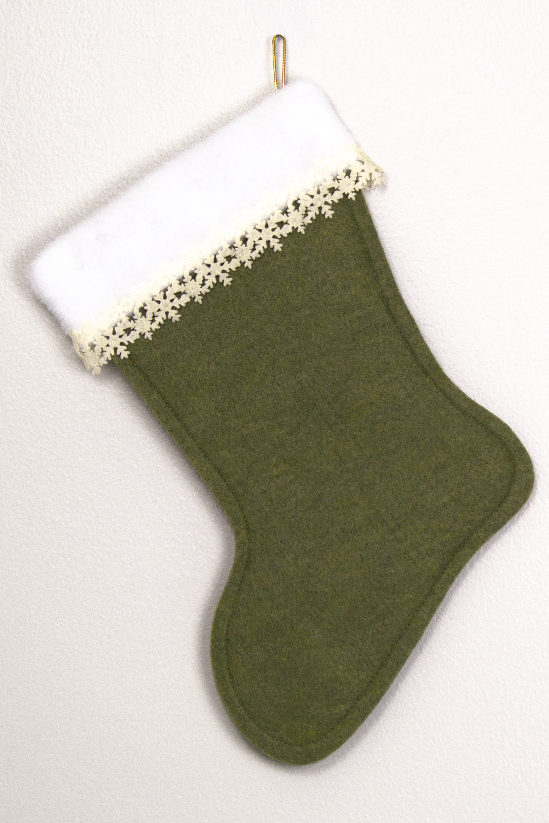 Olive Green felt handmade Christmas stocking with laser cut felt snowflake trim and decoration in gold and cream. (back of Dachshund dog stocking)