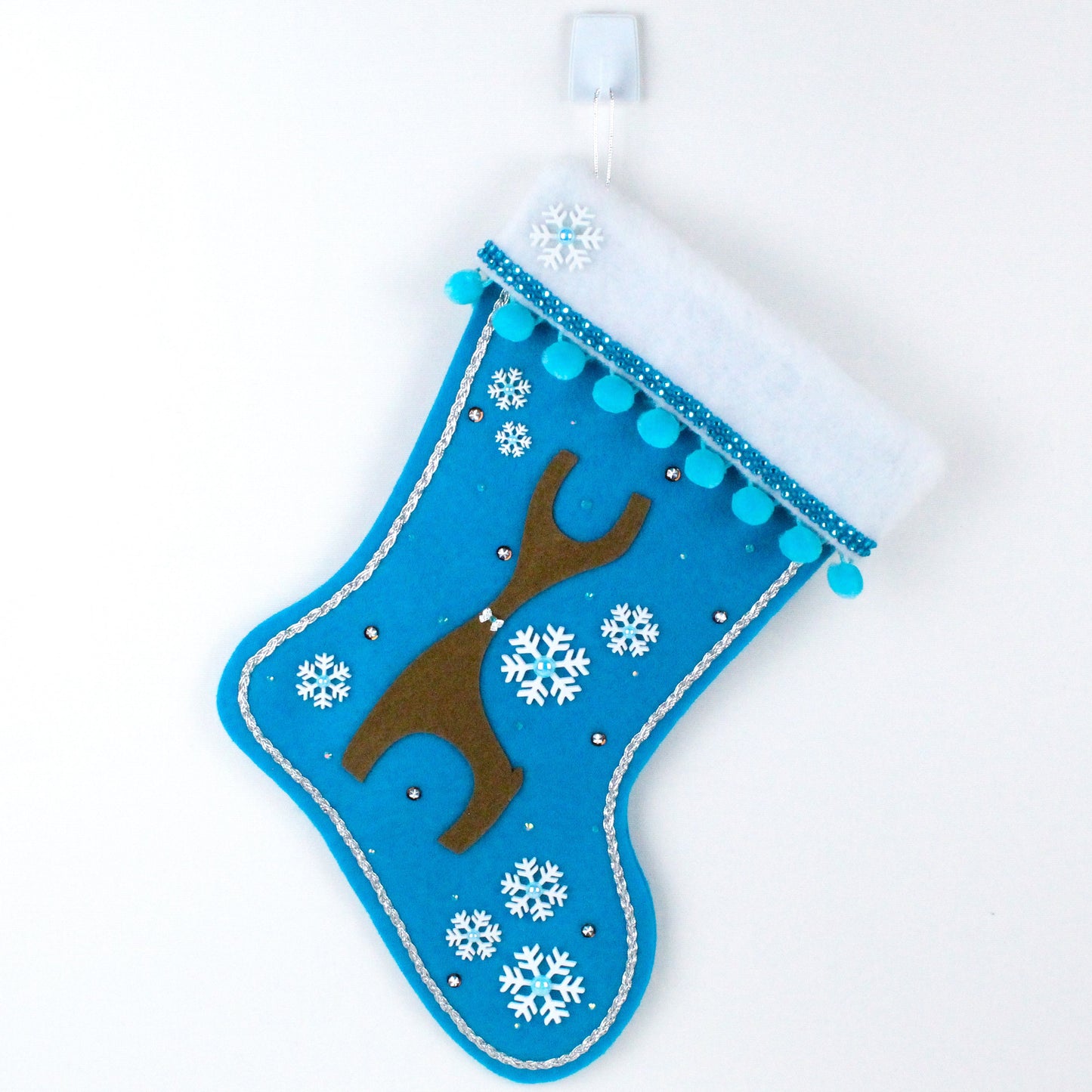 Brown Danish reindeer on blue felt Christmas stocking