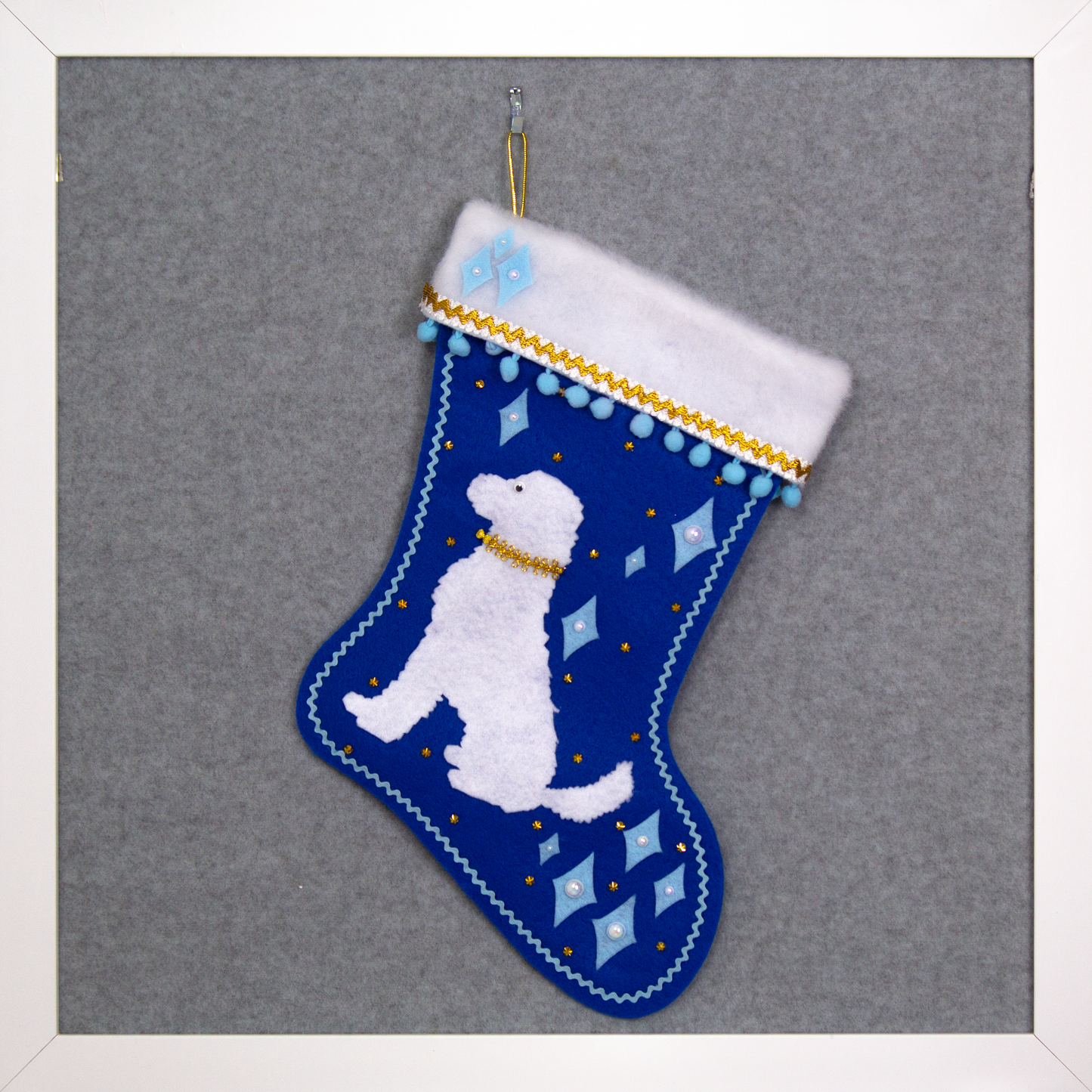 White Labradoodle dog on a royal blue felt OOAK handmade Christmas stocking with diamonds and gold decoration.