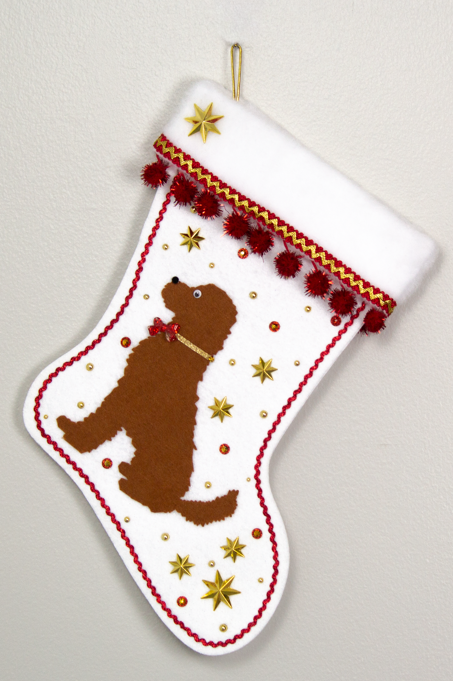 Brown Labradoodle dog on white felt Christmas stocking