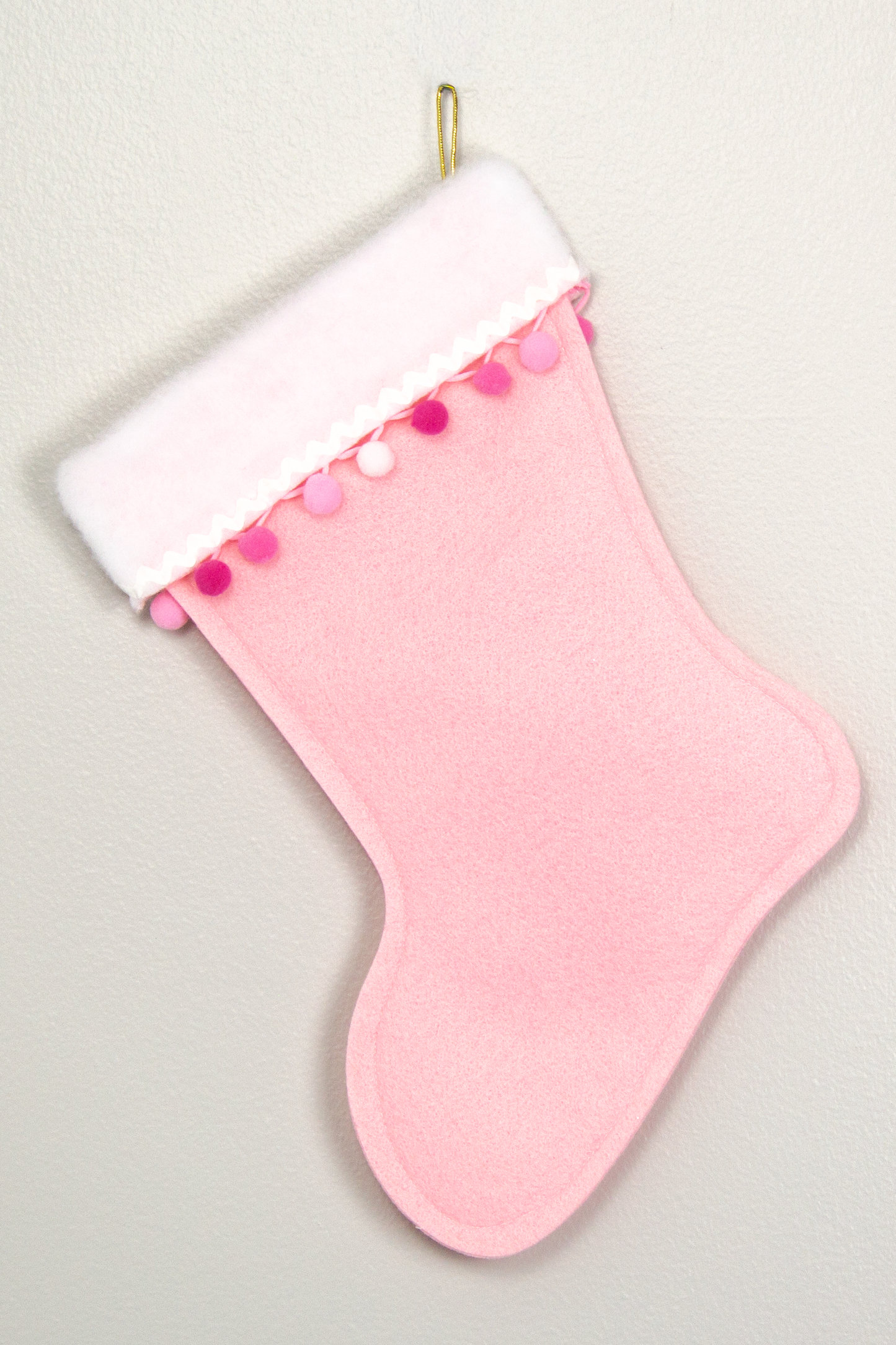Chocolate Labradoodle dog on pink felt Christmas stocking