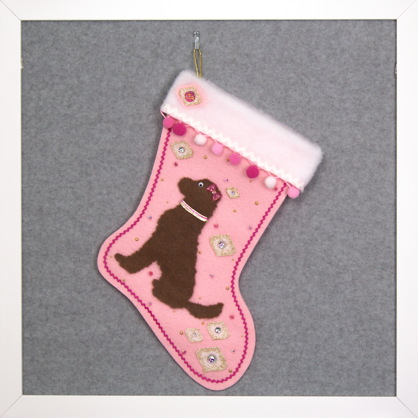 Chocolate brown labradoodle dog on light pink felt handmade one of a kind Christmas stocking with gold decoration.