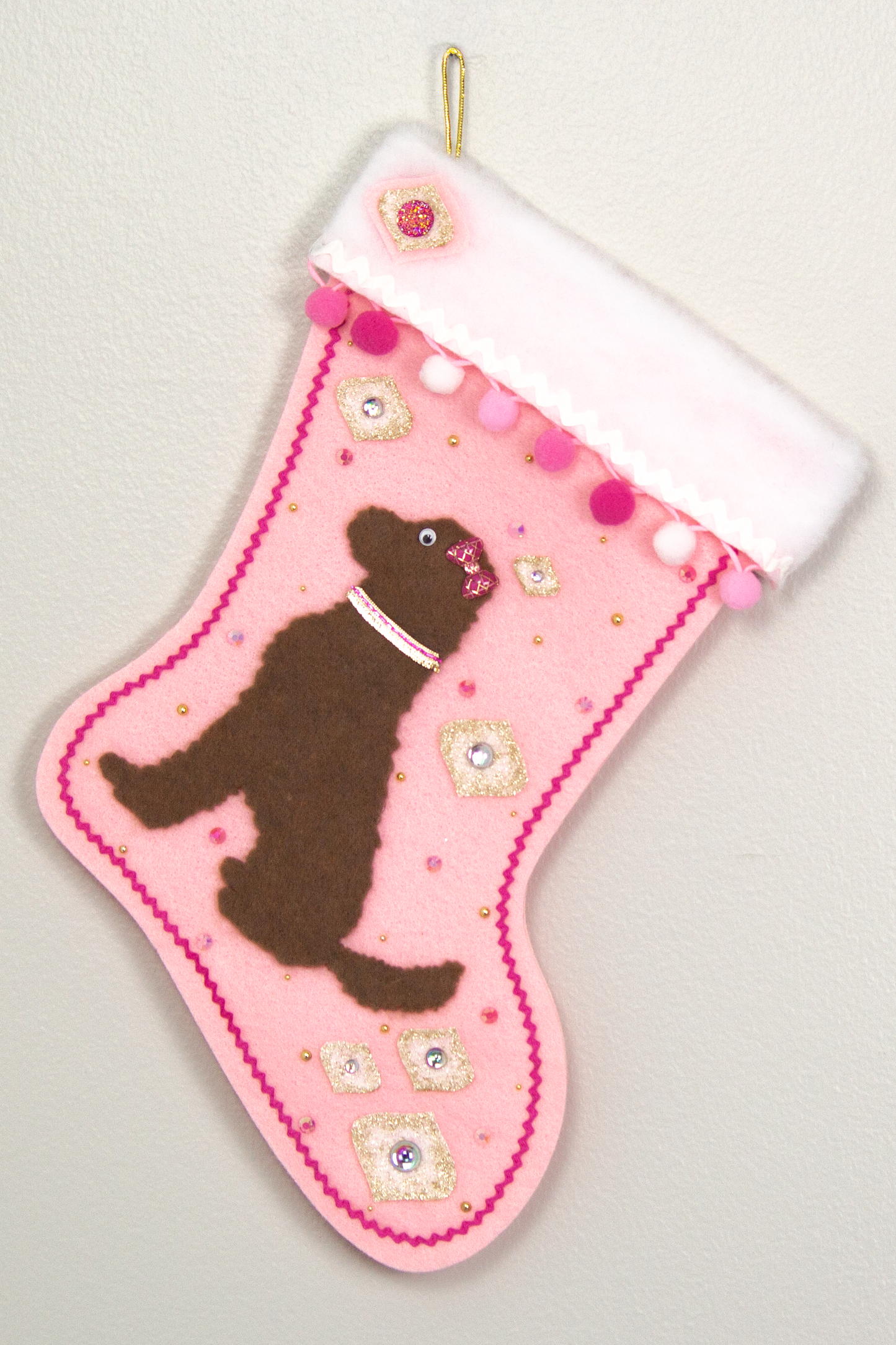 Chocolate Labradoodle dog on pink felt Christmas stocking