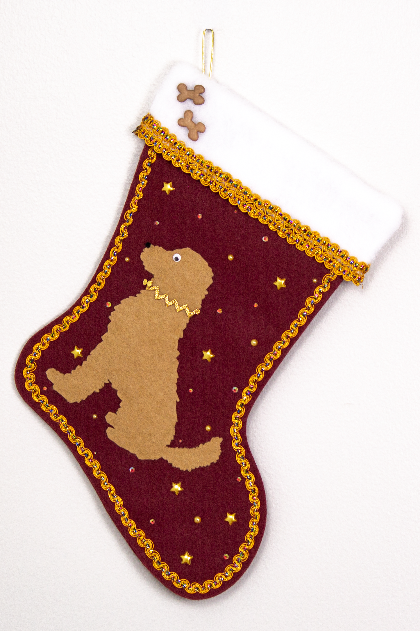 Tan Labradoodle dog on ruby red felt Christmas stocking