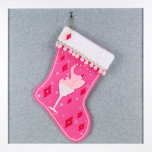 Light pink drunk elephant in a white glitter glass on candy pink felt OOAK handmade Christmas stocking with pink and silver decorations.