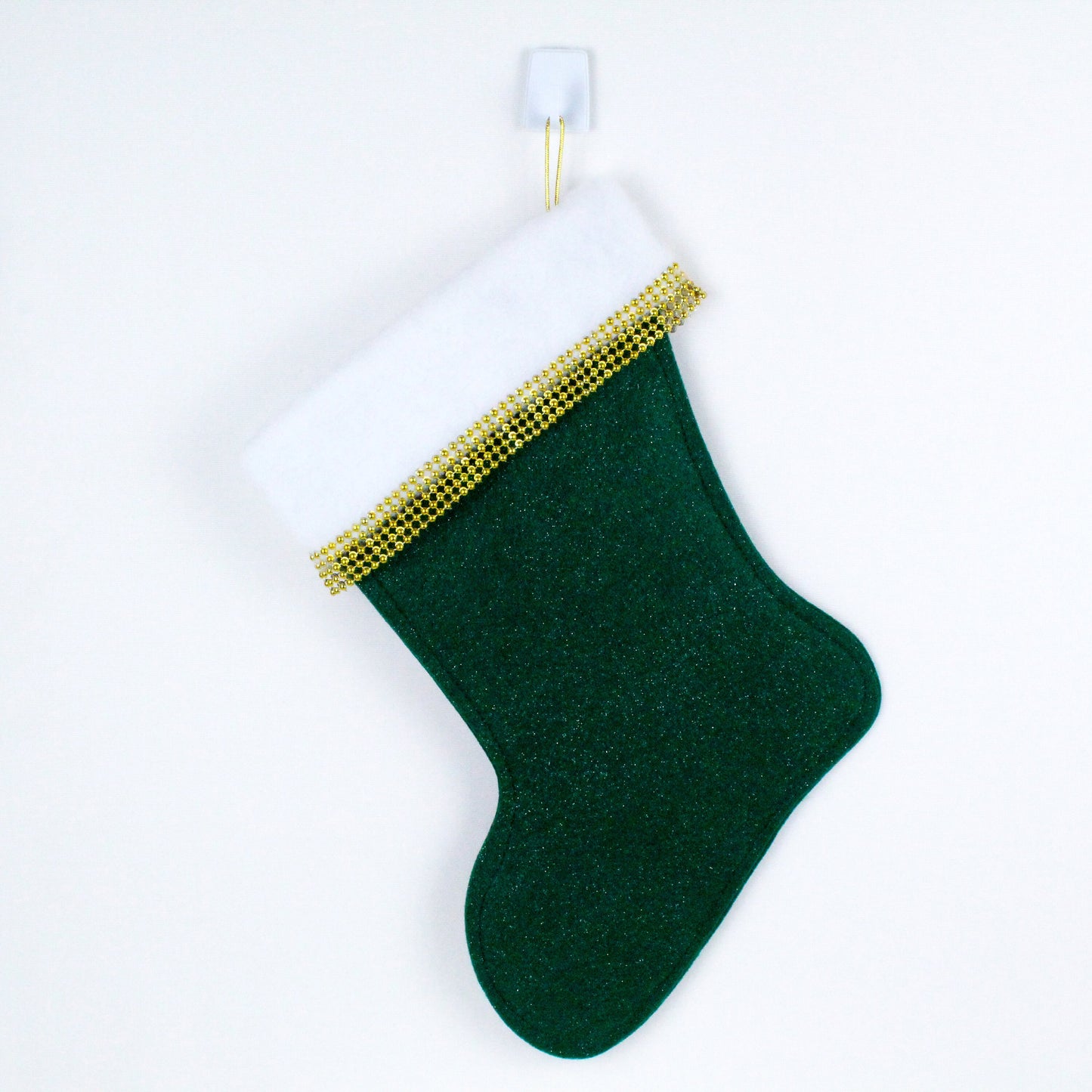 Light pink Drunk Elephant on dark green felt Christmas stocking