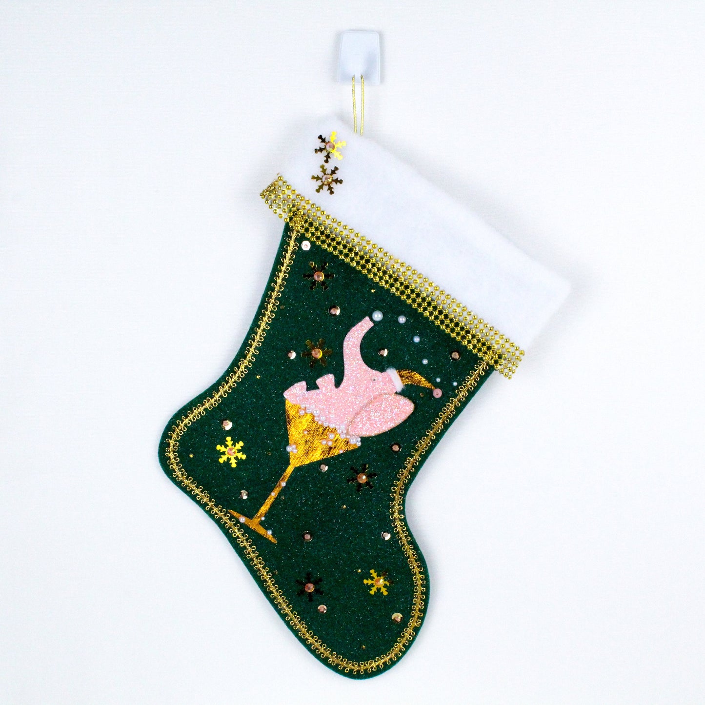 Light pink Drunk Elephant on dark green felt Christmas stocking