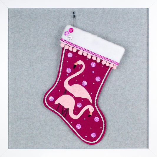 Light pink flamingos on fuchsia felt one of a kind handmade Christmas stocking with various pinks and silver decoration.