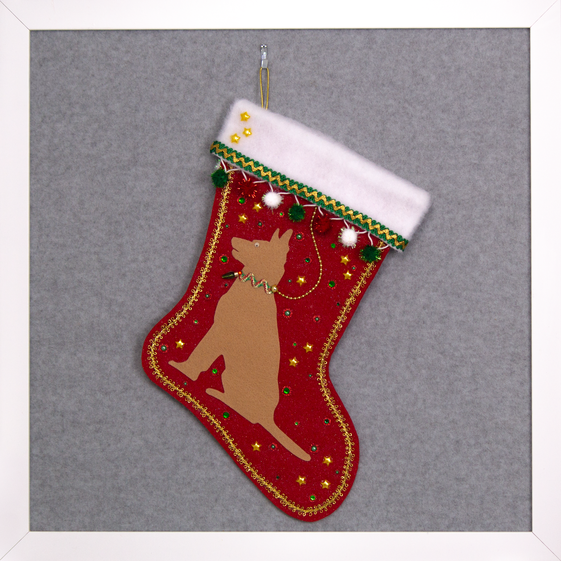 Tan German Shepherd dog on a red glitter felt handmade Christmas stocking with sparkly pom poms, stars and decorated in red, green, white and gold. (front of stocking)