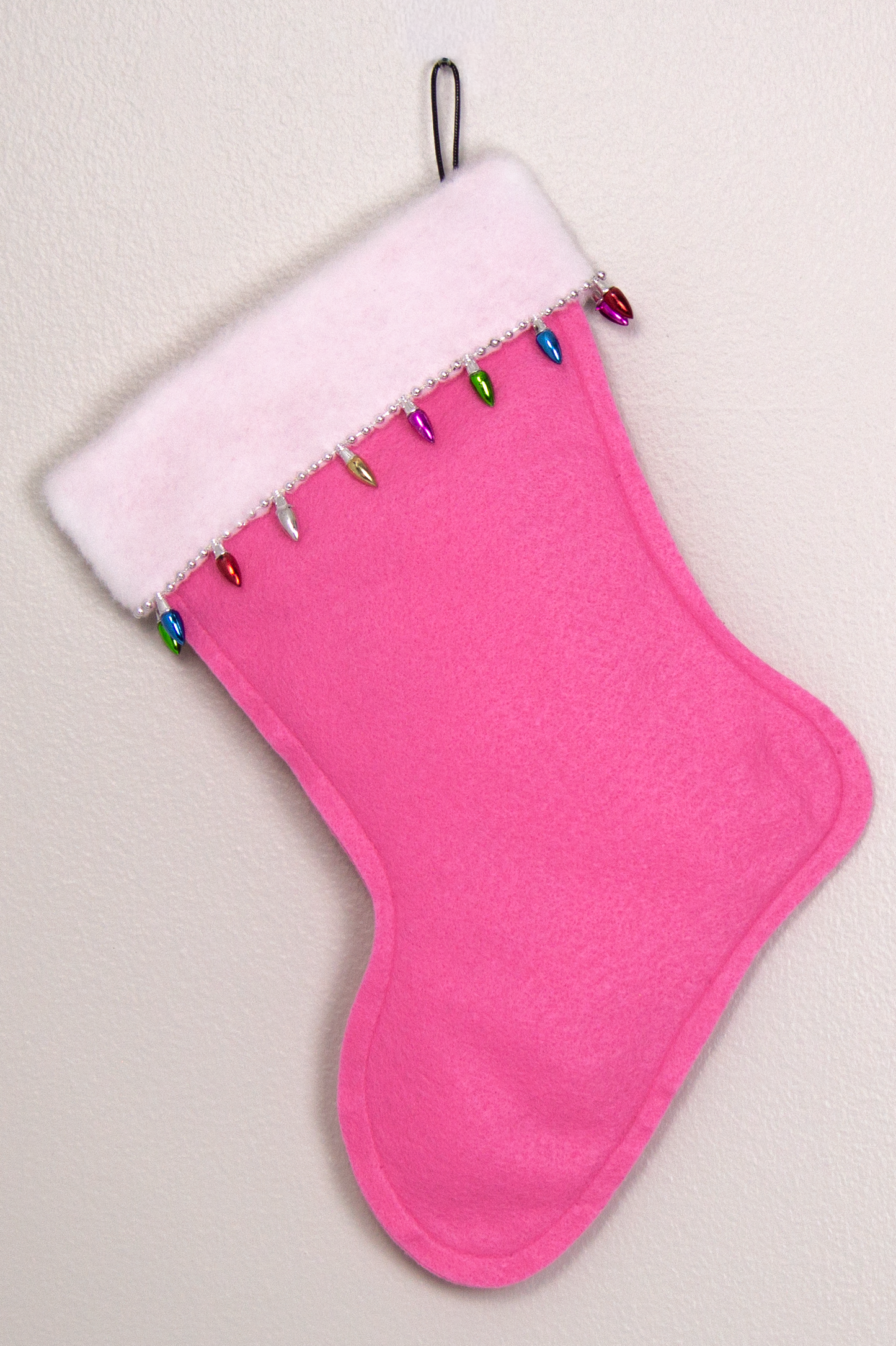 Candy pink felt handmade Christmas stocking with light bulb trim and decoration in silver and multicolors. (back of Glen of Imaal Terrier dog stocking)