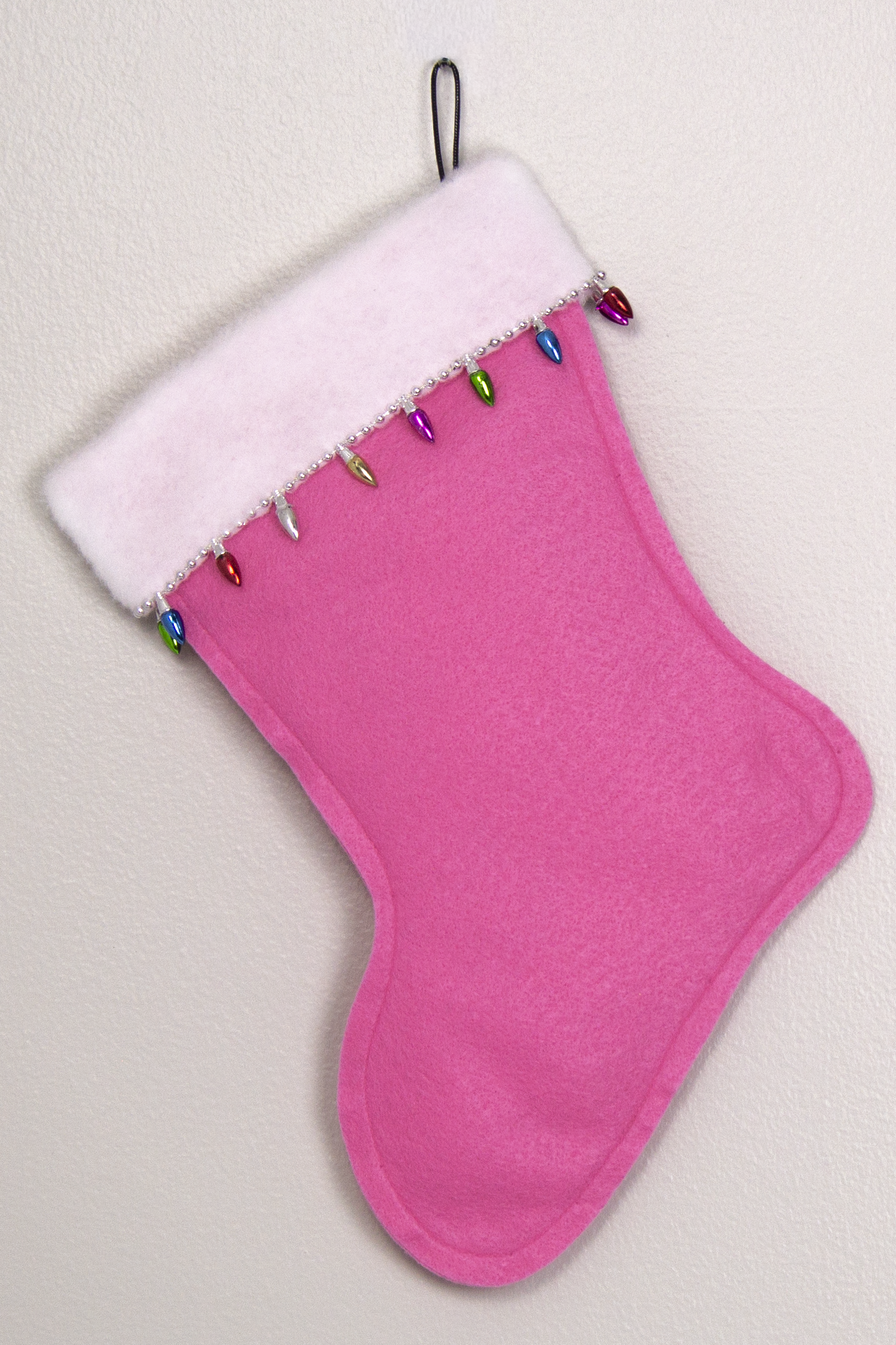 Candy pink felt handmade Christmas stocking with light bulb trim and decoration in silver and multicolors. (back of Glen of Imaal Terrier dog stocking)