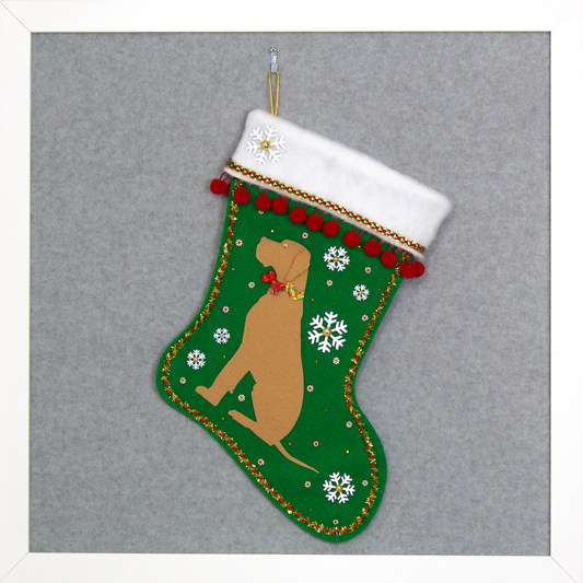 Tan Great Dane dog on holiday green felt handmade Christmas stocking with snowflakes, pom poms and decorated in white, green, red and gold. (front of stocking)