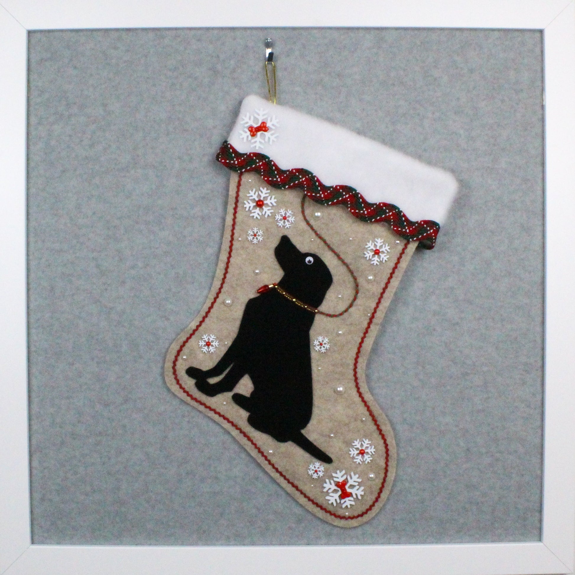 Black Lab Labrador Retriever on sandstone beige felt handmade one of a kind Christmas stocking with red, green, white and gold decoration.