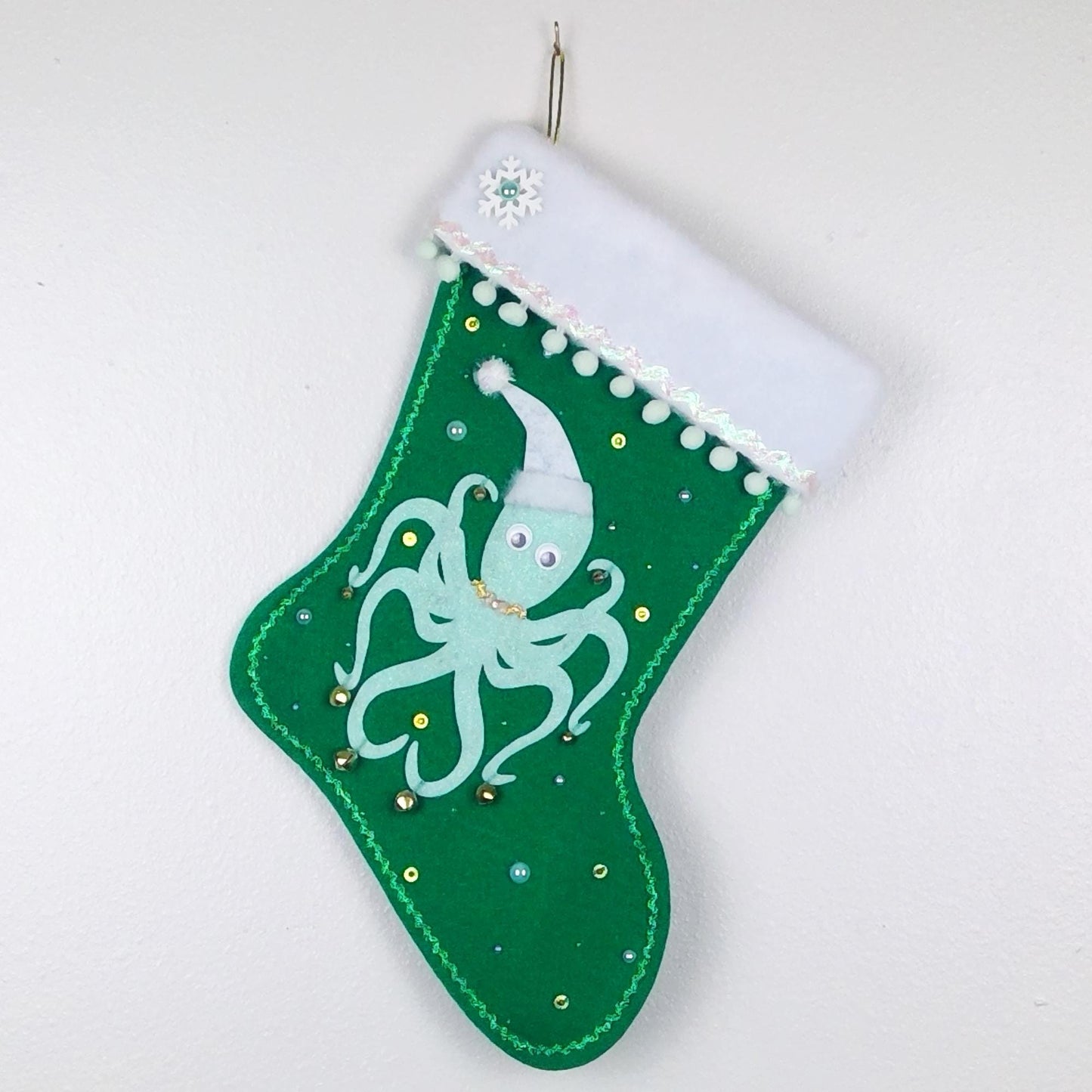 Mint octopus on green felt Christmas stocking