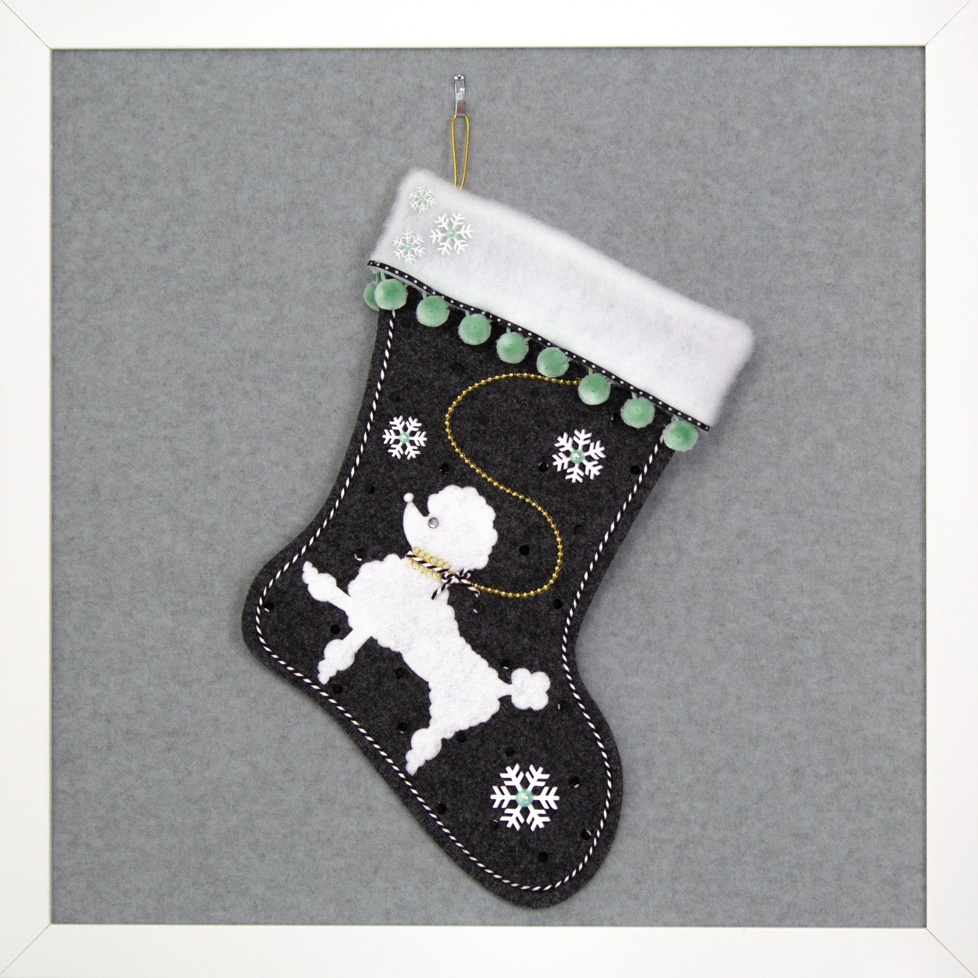 Charcoal gray Christmas stocking with white poodle design 