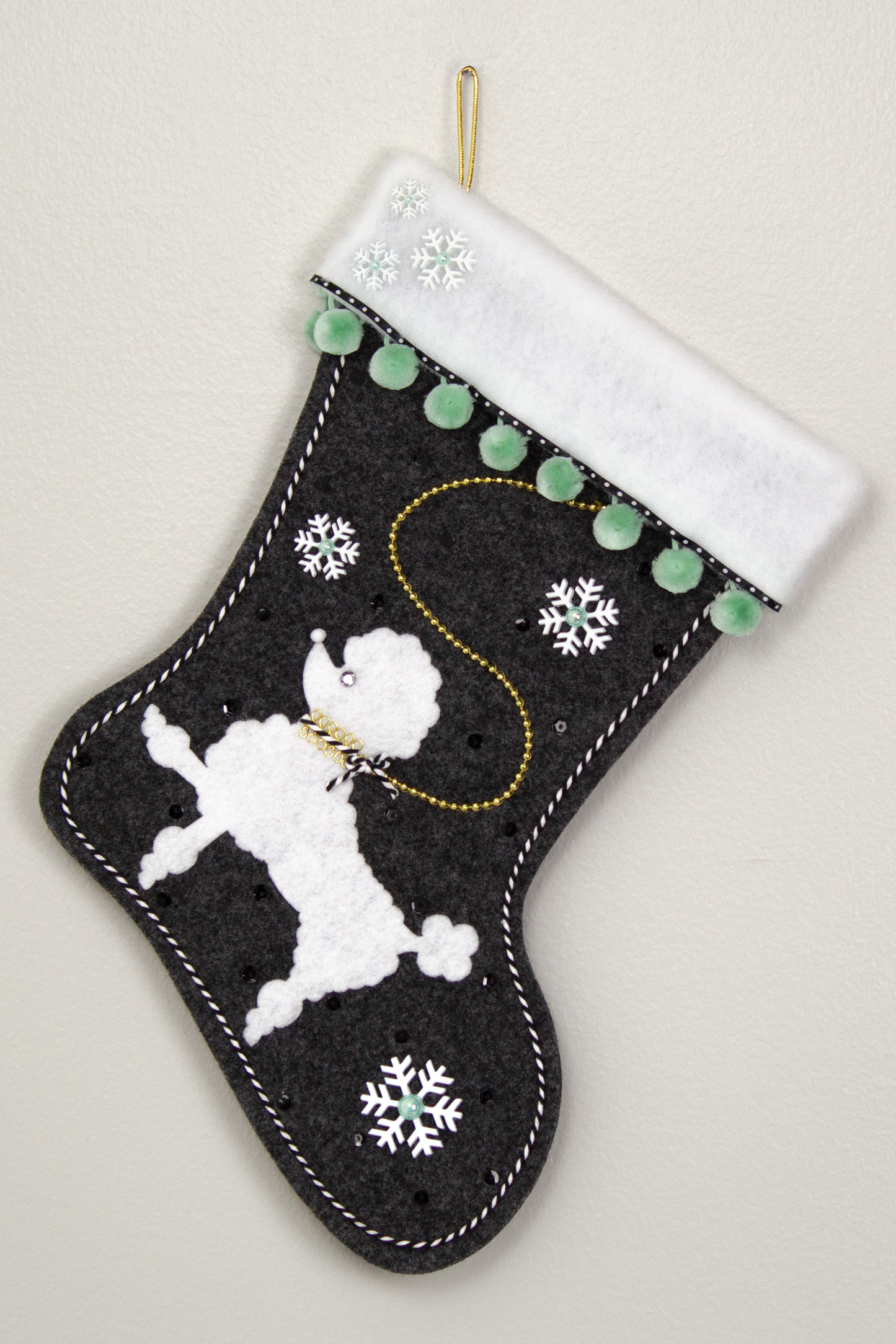 Charcoal gray Christmas stocking with white poodle design 
