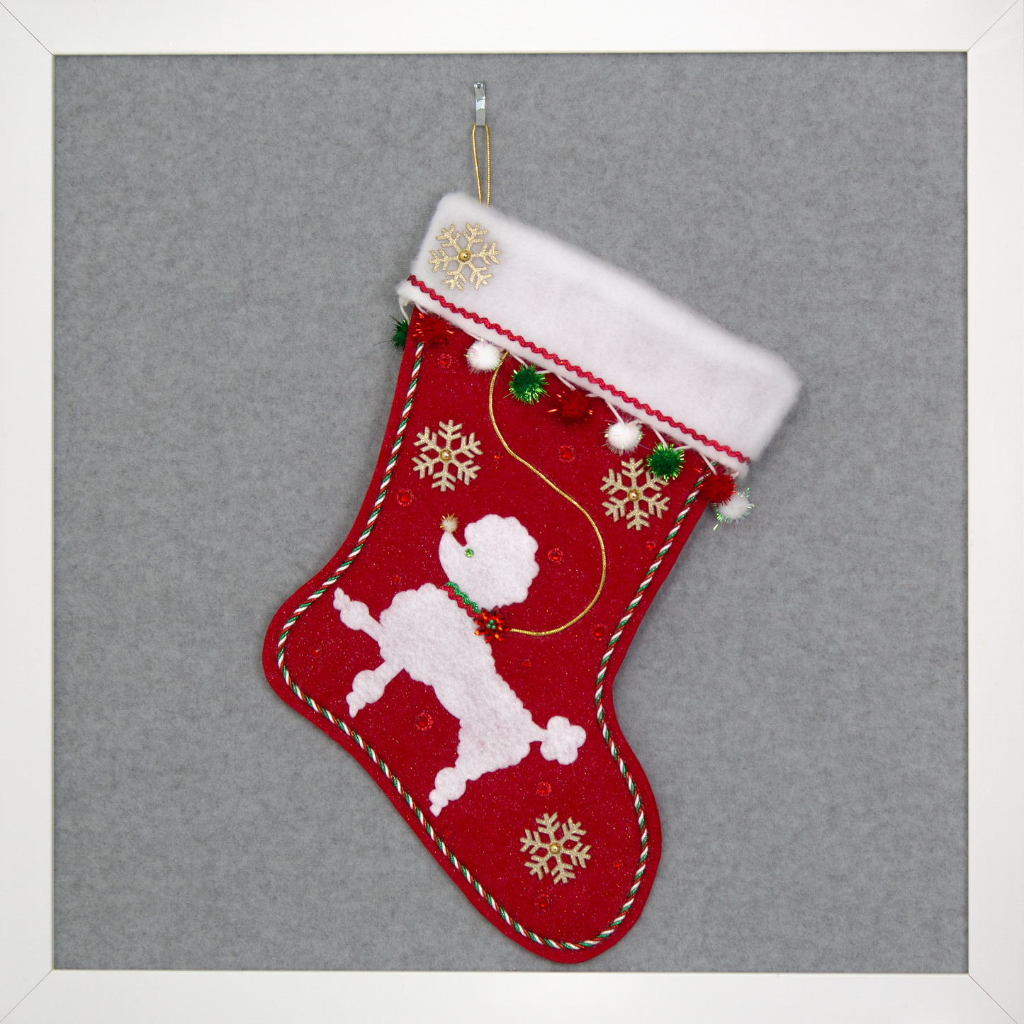 Red glitter Christmas stocking with white poodle design