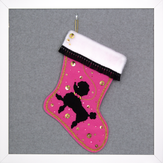 Pink Christmas stocking with black poodle silhouette design 