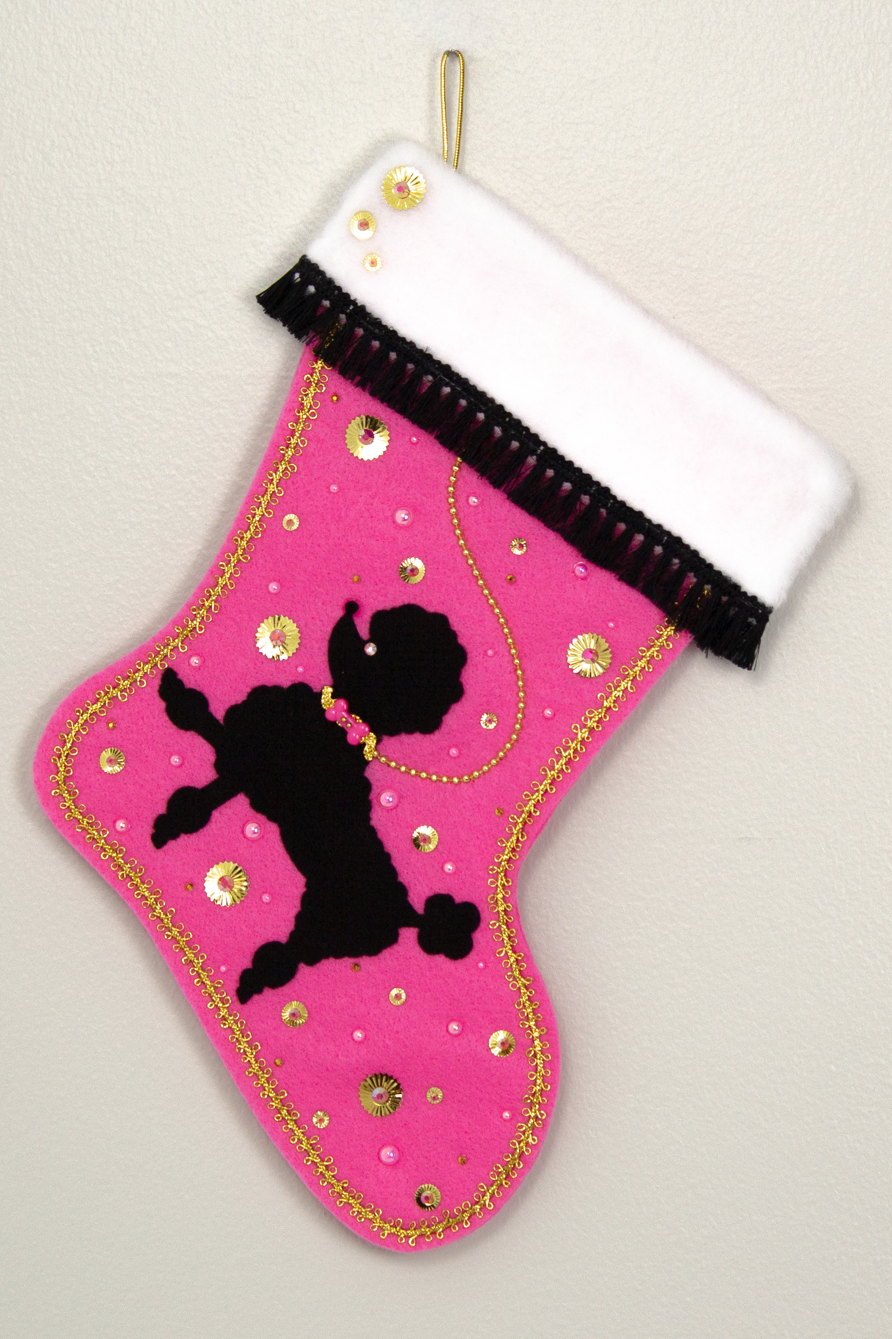 Pink Christmas stocking with black poodle silhouette design