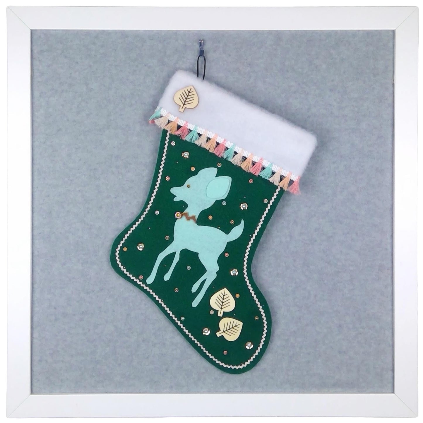 Mint green retro deer on dark green felt OOAK handmade Christmas stocking with multicolor pastel tassel fringe, natural wood leaves, and multicolor & gold accents