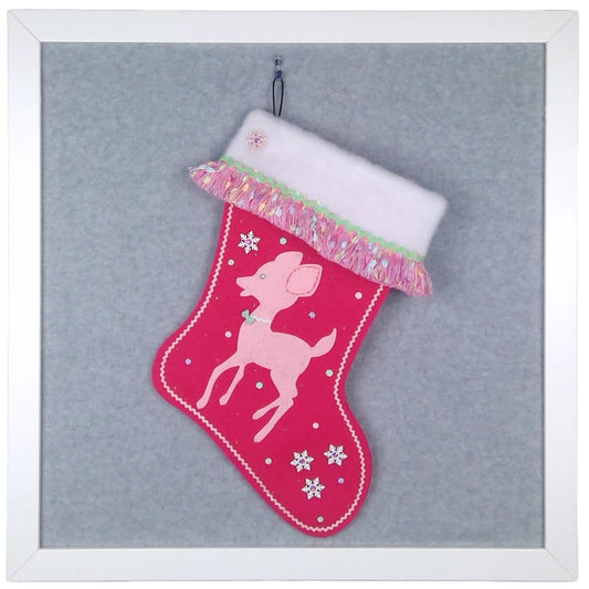 Light pink retro deer on shocking pink felt one of a kind handmade Christmas stocking with multicolor fringe, white od snowflakes, mint green decoration, and silver accents.