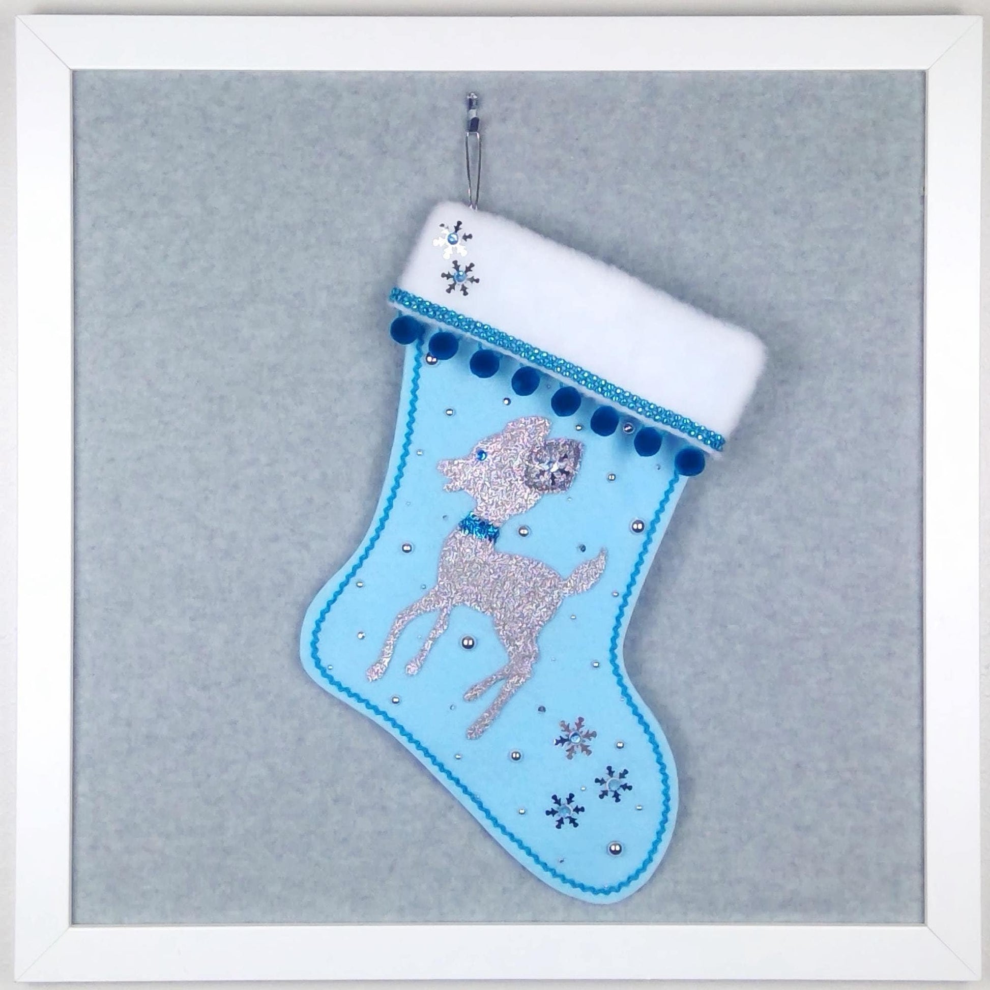 Sparkly silver retro deer on light blue felt OOAK handmade Christmas stocking with blue pom poms, silver sequin snowflakes, blue decorations and silver accents.