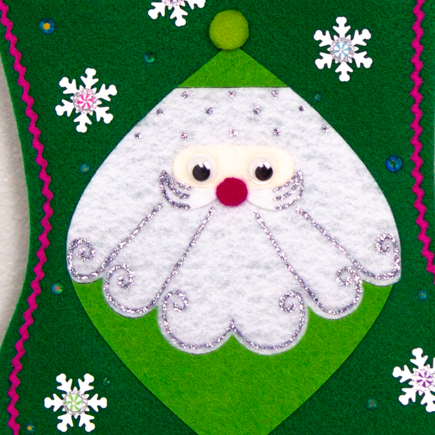 Marquise shaped Santa in green on a holiday green felt handmade Christmas stocking with snowflake sequins, clay candy pieces, pom poms and decorated in orange, purple, blue, greens, hot pink & silver. (front of stocking - close up of hand painted detail)