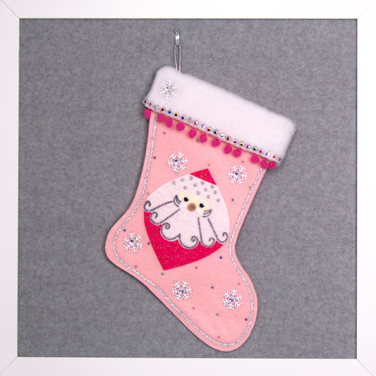 Marquise shaped Santa head (Holt Howard inspired) in hot pink glitter on a light pink felt handmade Christmas stocking with snowflake buttons, pom poms and decorated in hot pink, white, multicolors & silver. (front of stocking)