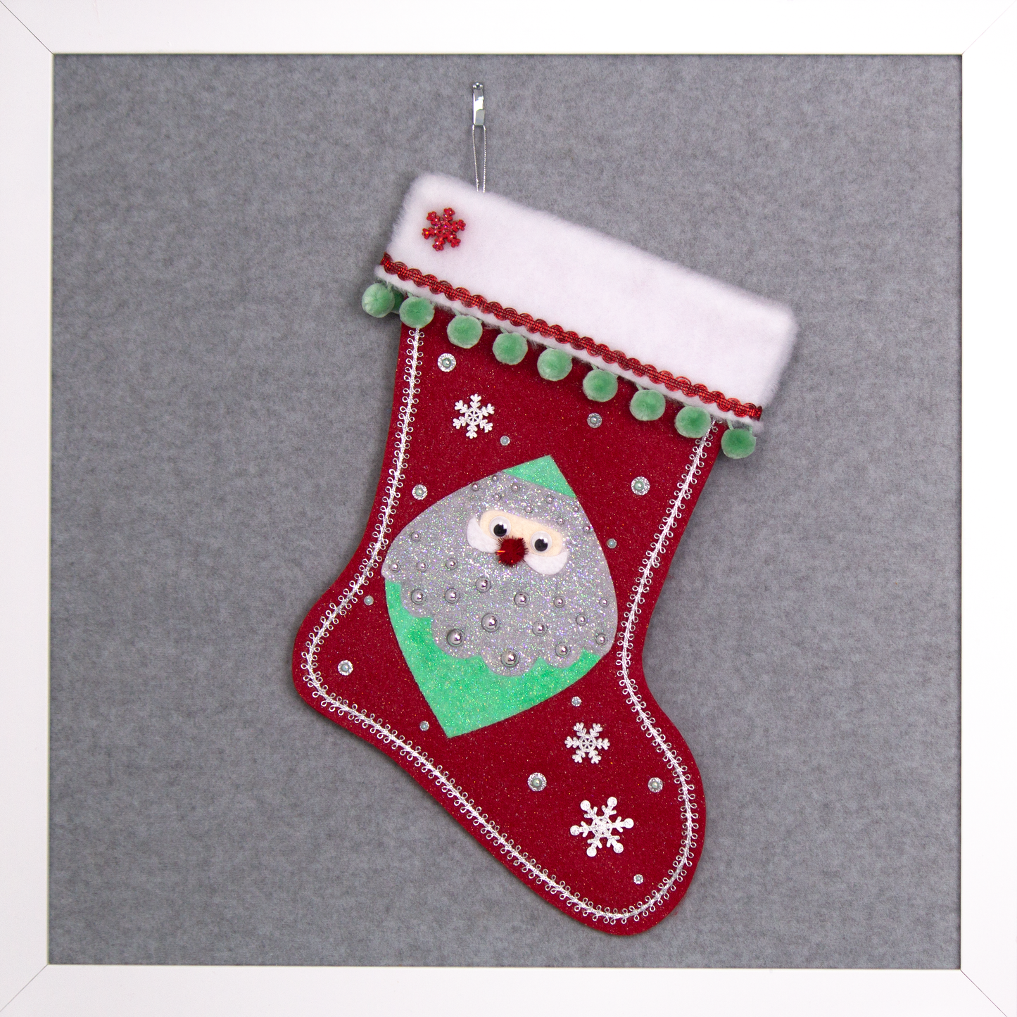 Marquise shaped Santa head (Holt Howard inspired) in silver and mint green glitter on a red glitter felt handmade Christmas stocking with wood snowflakes, pom poms and decorated in red, mint green & silver. (front of stocking)