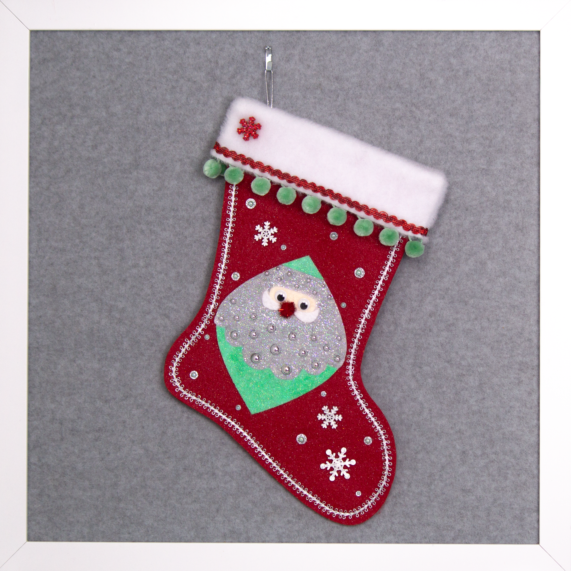 Marquise shaped Santa head (Holt Howard inspired) in silver and mint green glitter on a red glitter felt handmade Christmas stocking with wood snowflakes, pom poms and decorated in red, mint green & silver. (front of stocking)