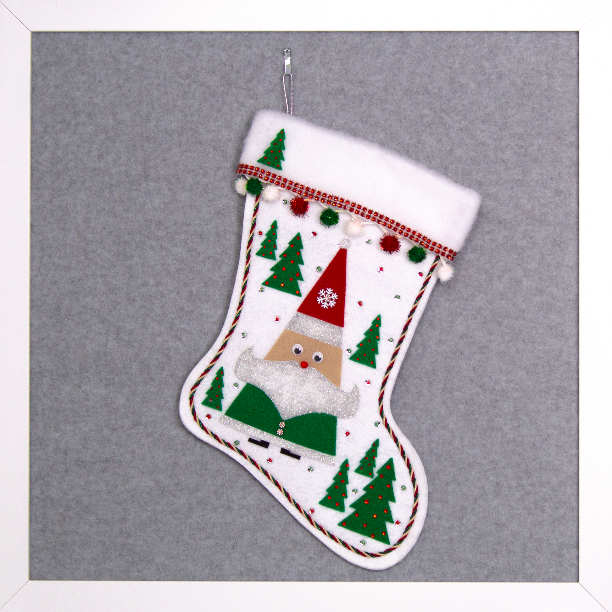 Triangular Santa (Holt Howard for Libbey inspired) in green suit and red hat on white glitter felt handmade Christmas stocking with trees, sparkly pom poms and decoration in red, green, white & silver. (front of stocking)