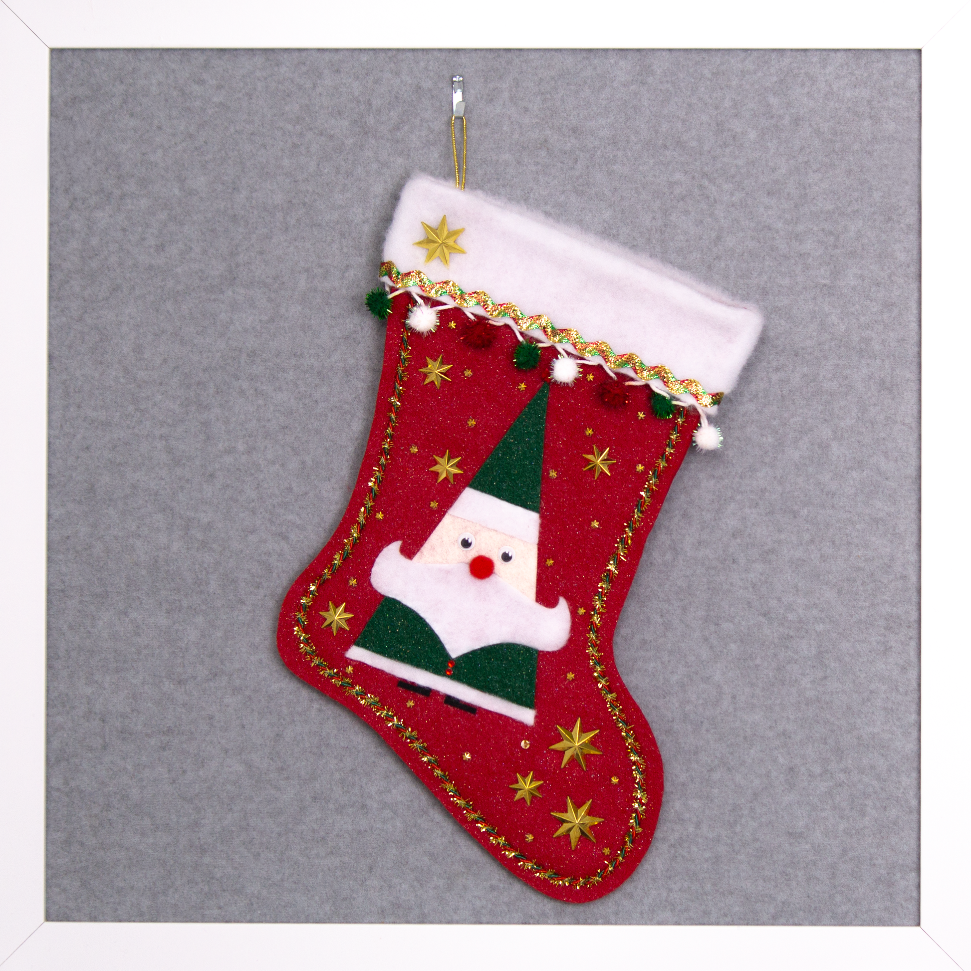 Triangular Santa (Holt Howard for Libbey inspired) in a glitter dark green suit on red glitter felt handmade Christmas stocking with star buttons, sparkly pom poms and decoration in red, green, white & gold. (front of stocking)