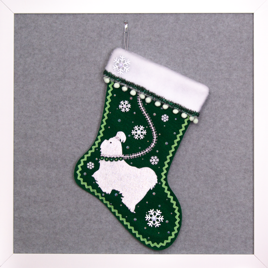 Glittered white Shih Tzu dog on dark green felt handmade Christmas stocking with pom poms, snowflake buttons, tinsel ribbon and decorations in white, mint green, silver, green and clear. (front of stocking)