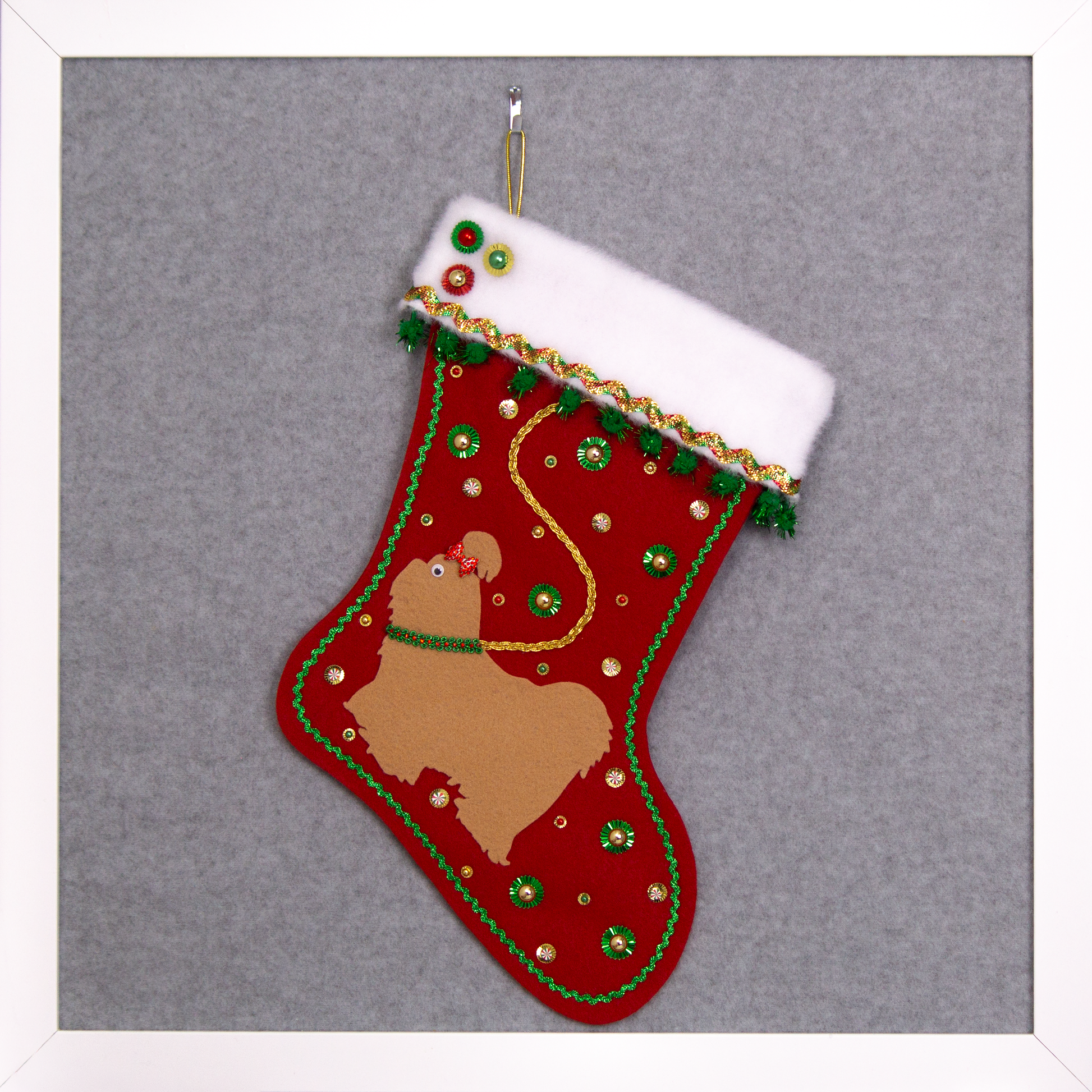 Tan Shih Tzu dog on holiday red felt handmade Christmas stocking with sunburst sequins, sparkly pom poms, metallic trim and decorations in red, green & gold. (front of stocking)