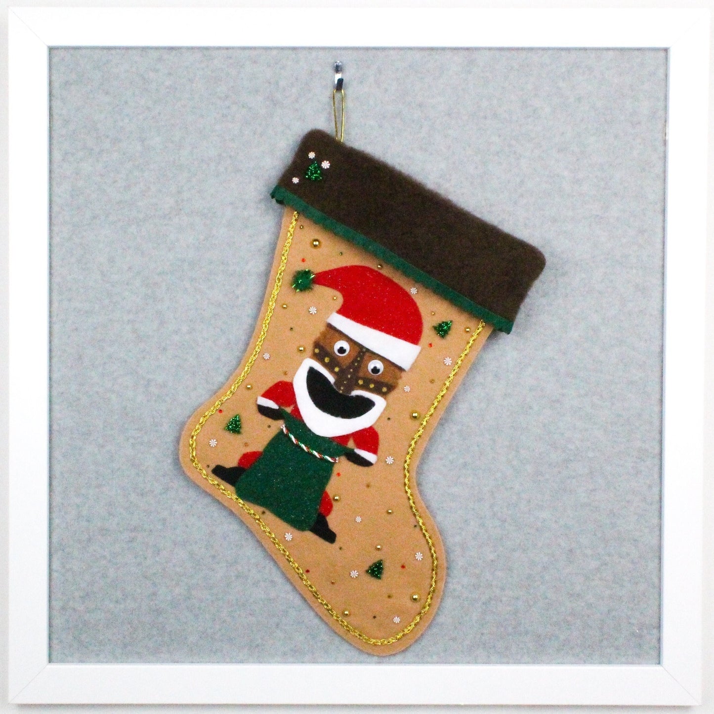 Tiki Santa on tan felt OOAK handmade Christmas stocking with dark green, red, white and gold decorations.