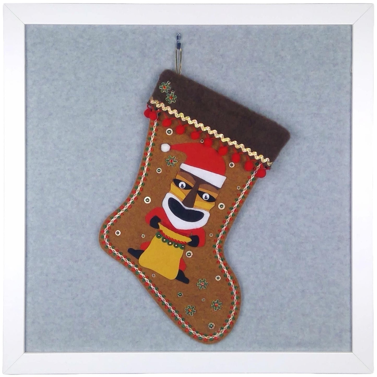 Tiki Santa on copper canyon felt handmade one of a kind Christmas stocking with pom poms, snowflakes and decorations in gold, red, dark green and white.
