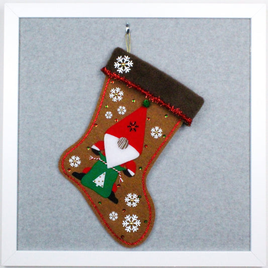 Tomte on copper canyon felt OOAK handmade Christmas stocking with snowflakes, tree, tinsel, flannel wood nose, and decorations in red, green, white and gold.