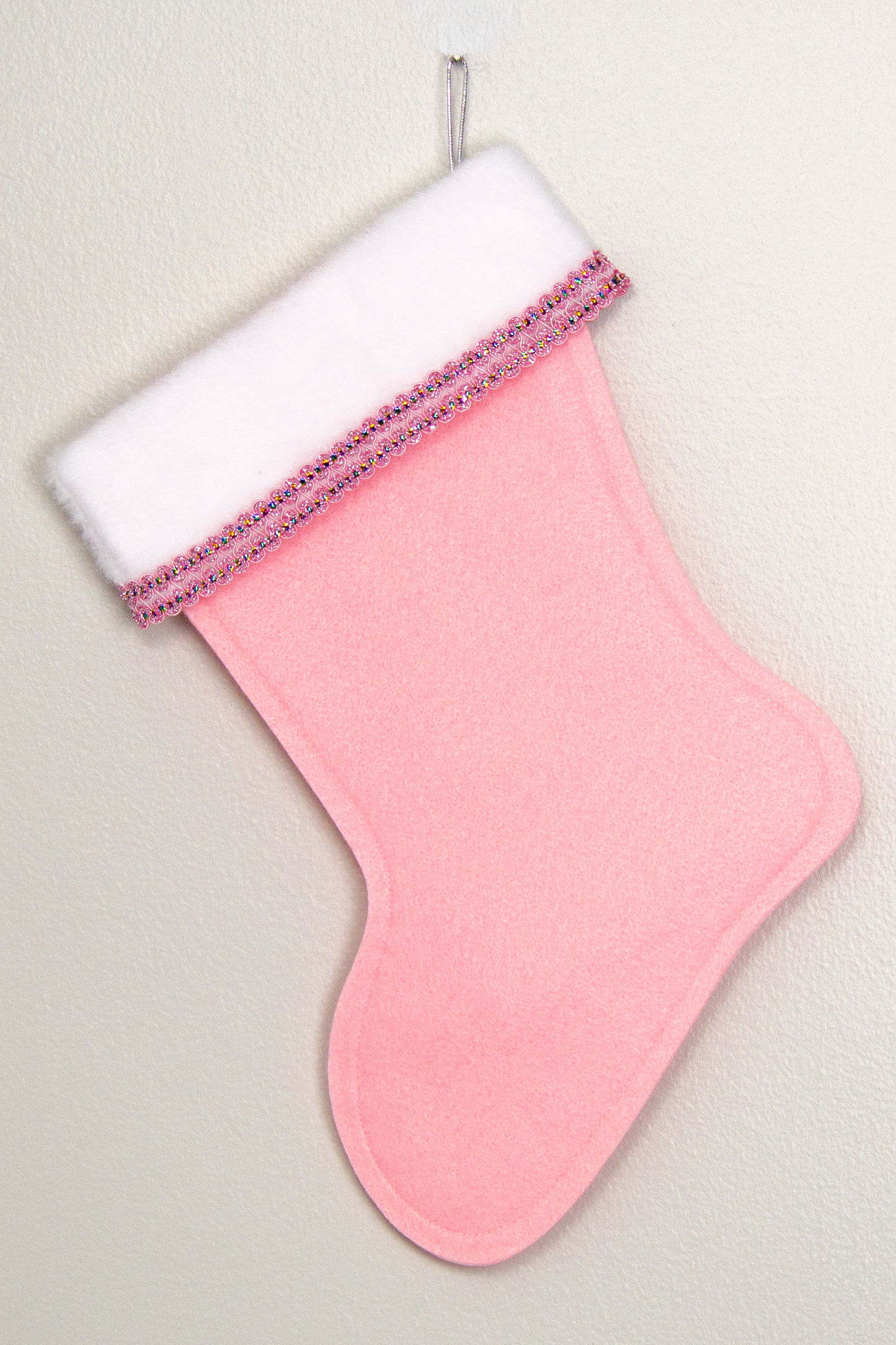 Light pink felt handmade Christmas stocking with decoration in light pink, silver & multicolors. (back of Tree stocking)