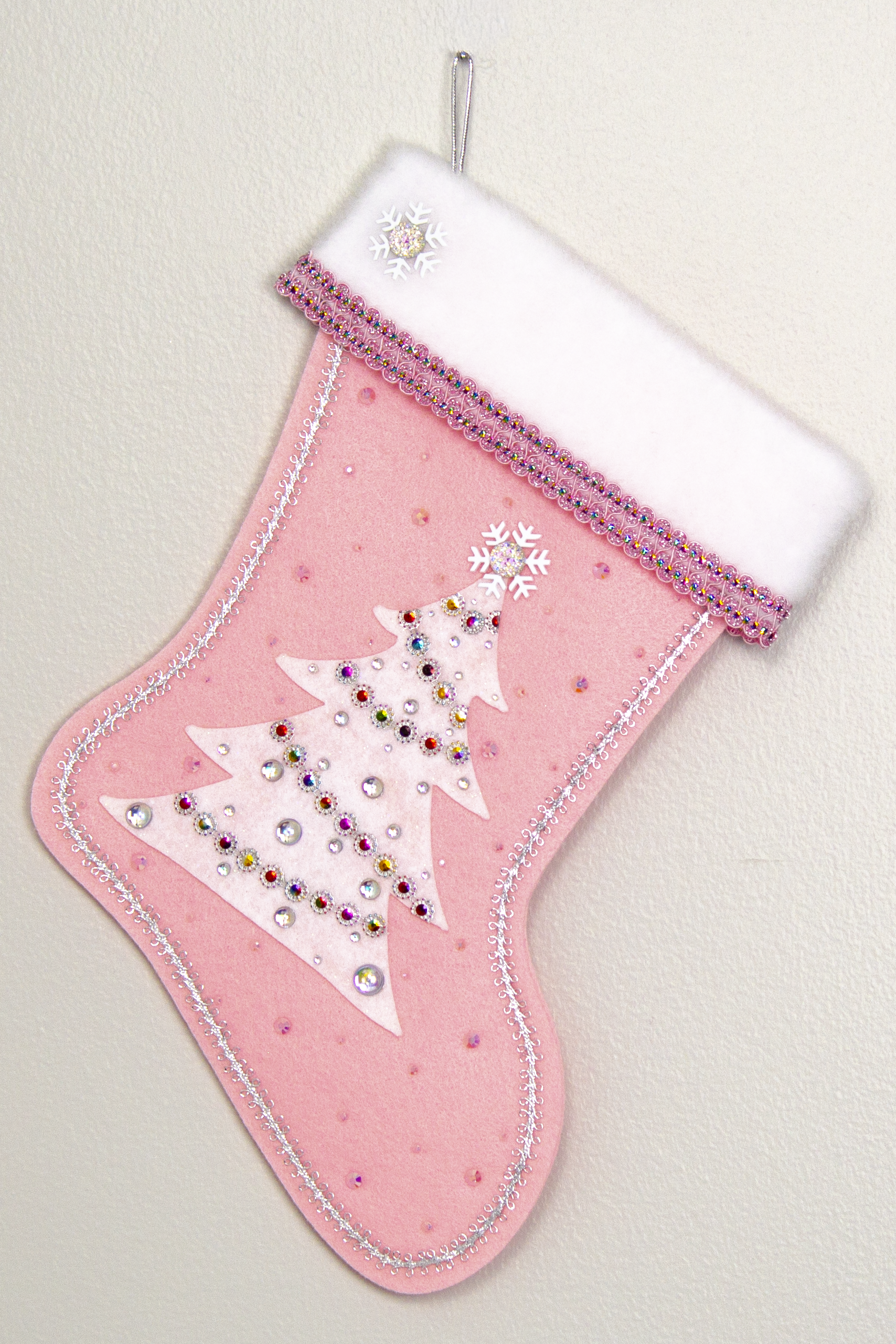 White glitter felt tree on light pink felt handmade Christmas stocking with snowflake buttons, large multifaceted rhinestones and decorated in white, clear, light pink, silver & multicolors. (front of Tree stocking)